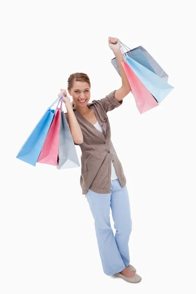 Glückliche Frau mit ihren Einkaufstaschen — Stockfoto