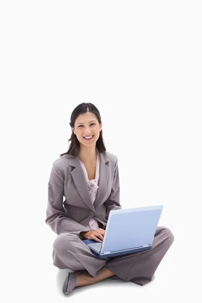 Woman sitting with her notebook — Stock Photo, Image