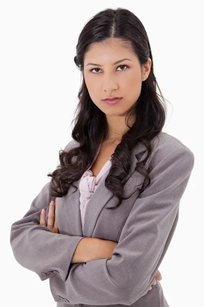 Serious businesswoman with arms folded — Stock Photo, Image