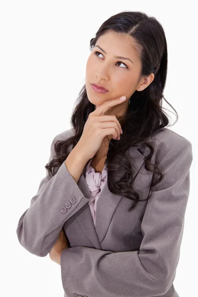 Thoughtful businesswoman touching her chin — Stock Photo, Image