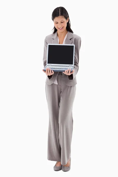 Businesswoman presenting notebook — Stock Photo, Image