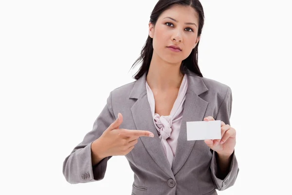 Businesswoman pointing at name badge — Stock Photo, Image