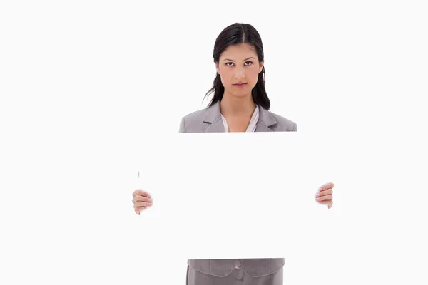 Businesswoman with blank sign board — Stock Photo, Image