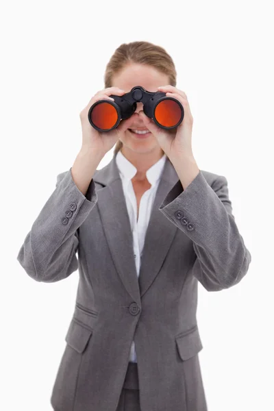 Bank employee looking through spyglasses — Stock Photo, Image