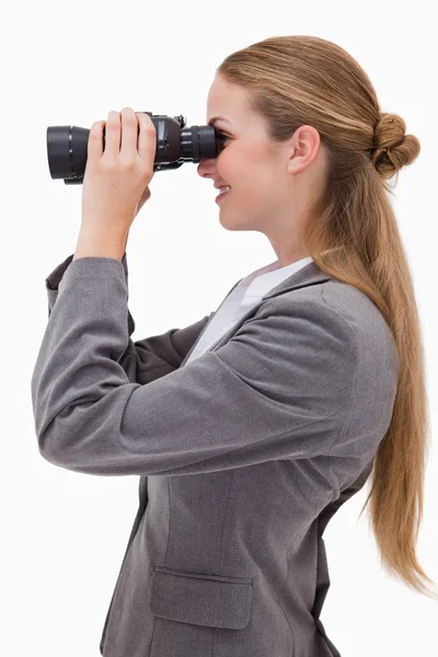 Side view of smiling bank employee with spyglasses — Stock Photo, Image