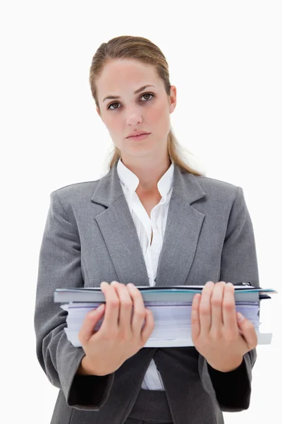 Desperate office employee with pile of paperwork — Stock Photo, Image