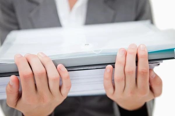 Pile of paperwork being held by female hands — Stock Photo, Image