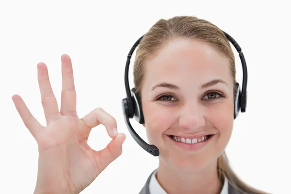 Smiling call center agent approving — Stock Photo, Image