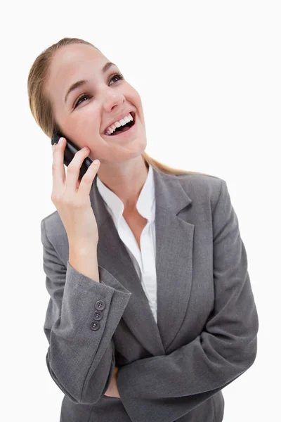 Laughing bank employee on her cellphone — Stock Photo, Image