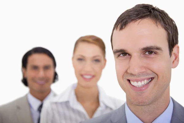 Glimlachend businessteam staan in een rij Stockfoto