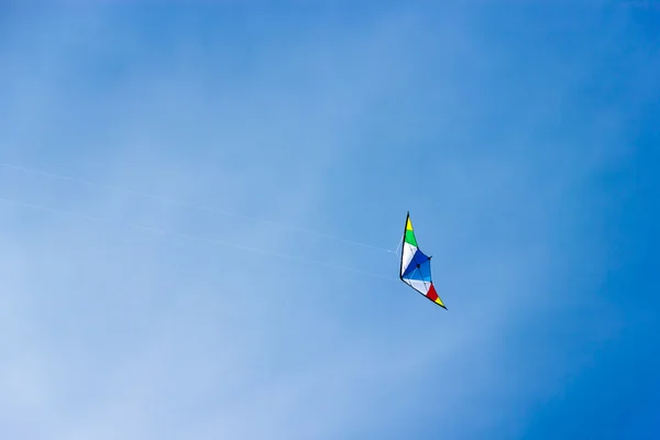 stock image Colorful kite soaring in a nice blue sky