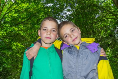 Portrait of two hugging boys, tweens clipart