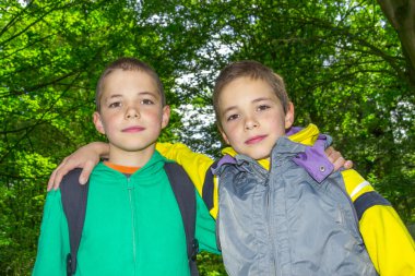 Portrait of two hugging boys, tweens clipart