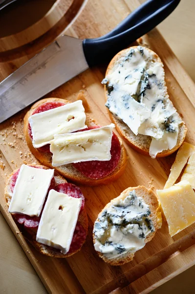 Sandwiches with gorgonzola, brie and salami