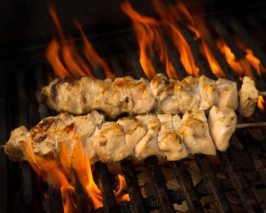 Chicken brochette on grill clipart