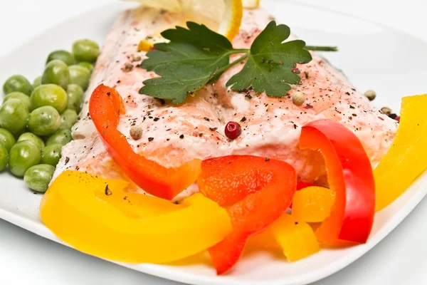 Fillet of salmon with vegetables and peas — Stock Photo, Image