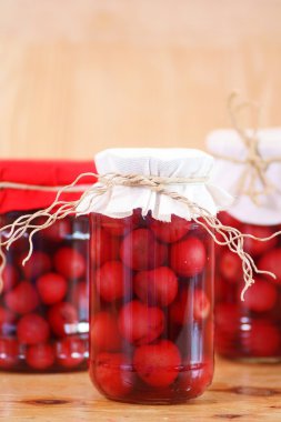 Jars with cherry compote clipart