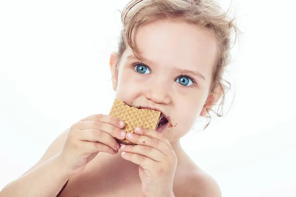 stock image Beautiful sweet little girl eating a cookie