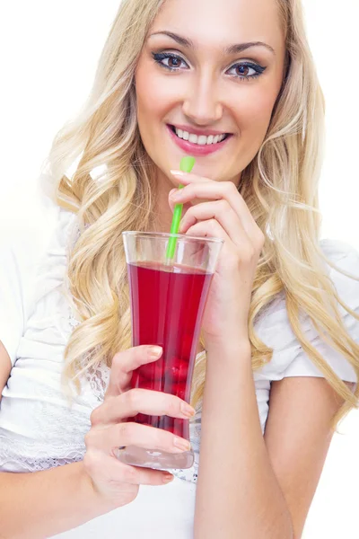 Young woman drinking lemonade, studio-shot — Stock Photo, Image