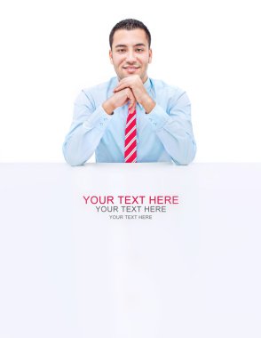 Handsome businessman on a desk-space for text clipart