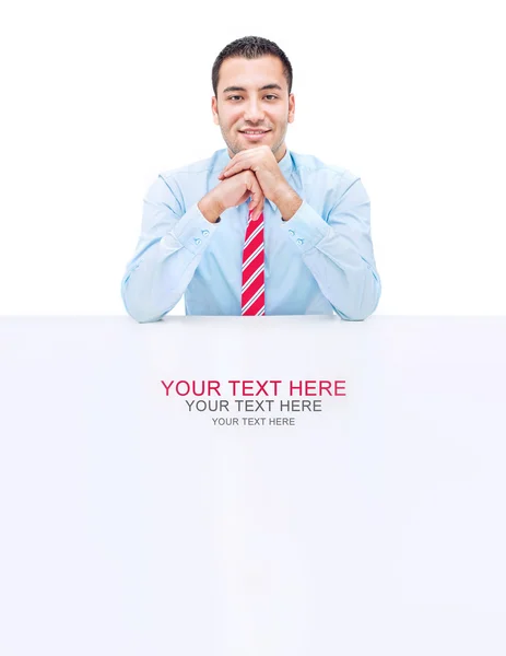 Handsome businessman on a desk-space for text — Stock Photo, Image