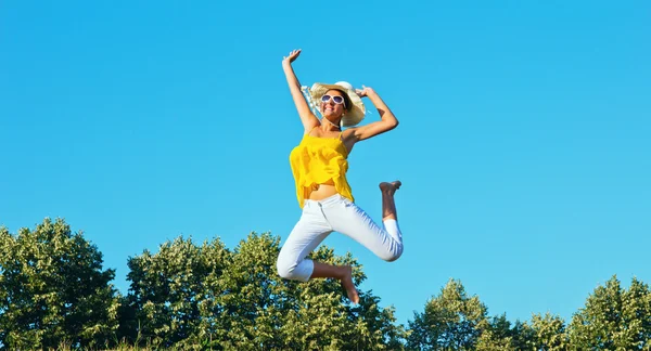 Happy beautiful woman jumping with copy space — Stock Photo, Image
