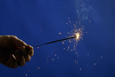 Photo of sparkler in hand clipart