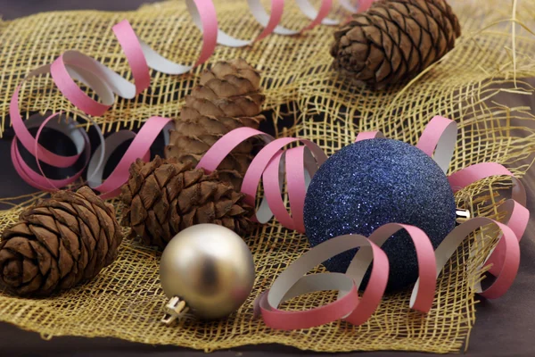 Christmas card with cones and balls — Stock Photo, Image