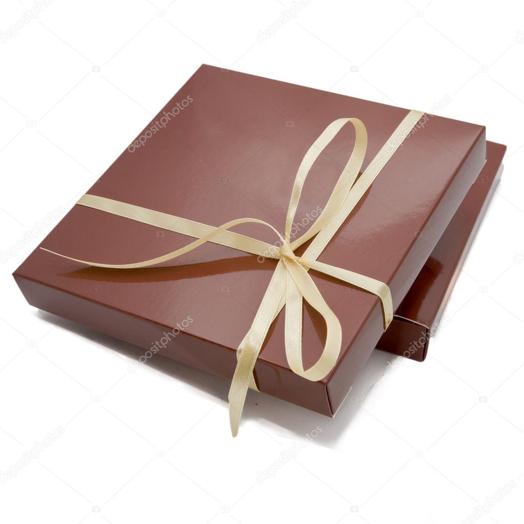 Chocolate color box for candy, tied beige ribbon. Sweet gift or surprise for your favorite. Ready for your logo. Isolated on white background with clipping path