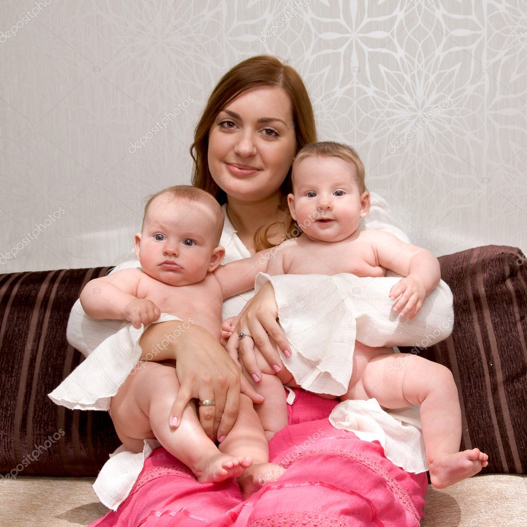 Breast Feeding Two Little Sisters Twin Baby Girls Stock Photo
