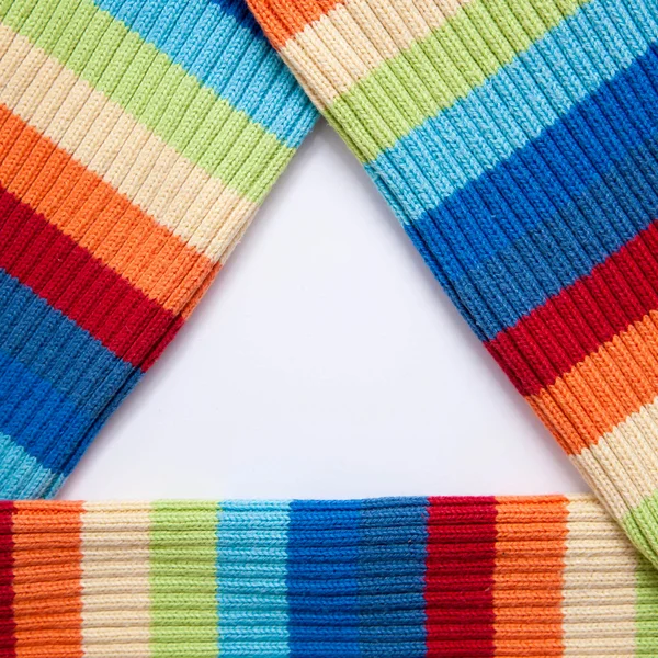 Triangular frame of multicolored knitted fabric. — Stock Photo, Image