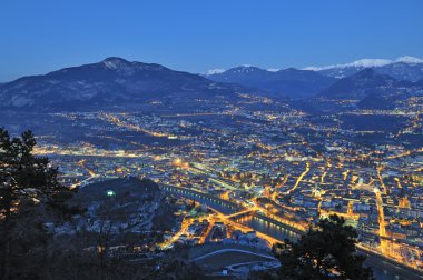 Overview of Trento in night time clipart