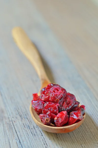 Spoon of dried cranberries — Stock Photo, Image
