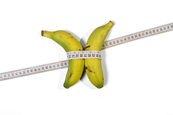 Банани і вимірювальна стрічка Стокове Зображення