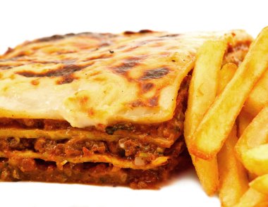 Homemade traditional lasagna and fries clipart