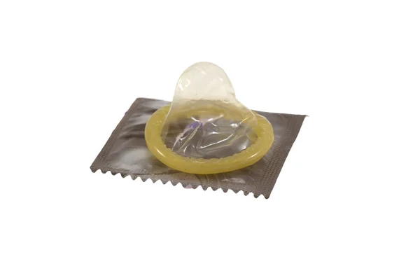 Kondom ležela na jeho balíčku — Stock fotografie