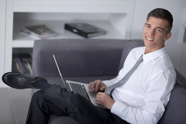 Successfull businessman working with a notebook and sitting — Stock Photo, Image