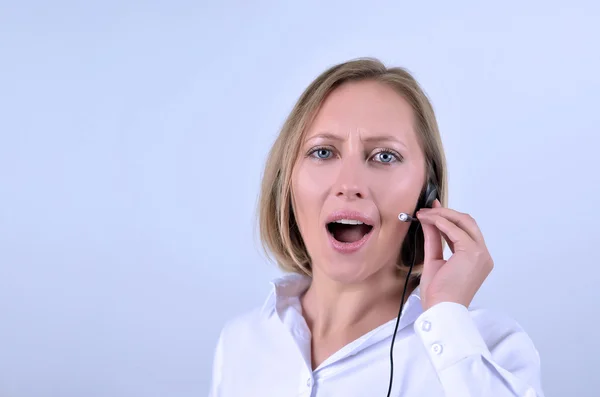 Successful businesswoman with headphone talking on phone — Stock Photo, Image