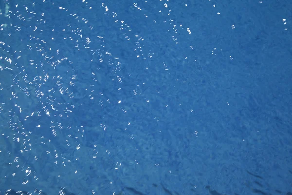 stock image Background of rippled pattern of clean water in a blue swimming