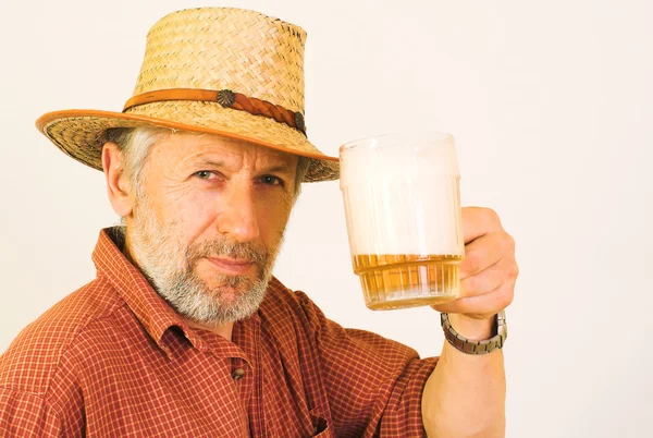 Elderly guy with a mug of beer — Stock Photo, Image