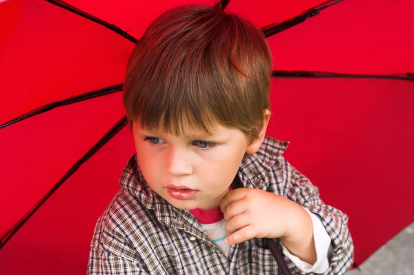 Stock image Boy with the umbrella