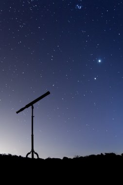 Night shot with a silhouette of a telescope clipart