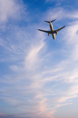 Clouds and the plane clipart