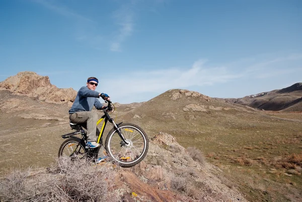 Bicyclist in mountain terrain