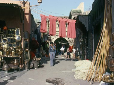 MARRAKECH, MOROCCO – AUGUST, 1979: walking down a shopp