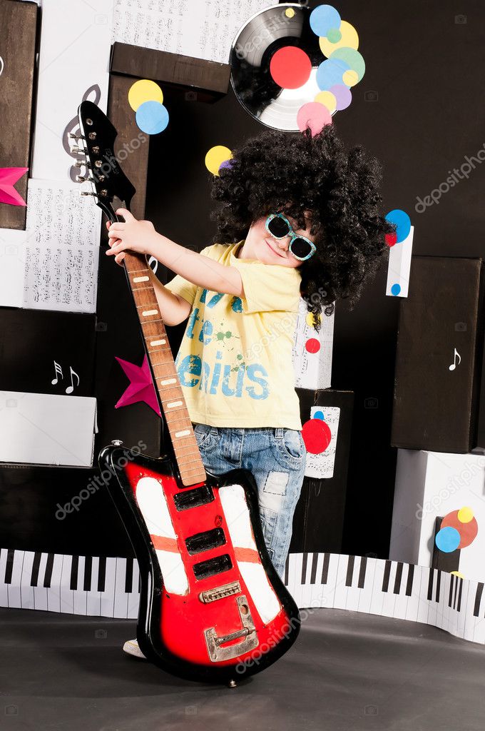 Boy holding an electric guitar