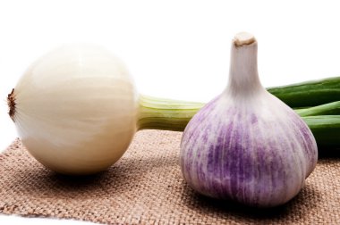 Onion and garlic on an isolated background clipart