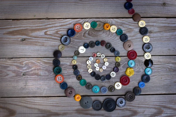 Bottoni vintage su vecchio tavolo in legno — Foto Stock