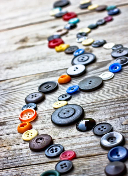 Vintage buttons on old wooden table — Stock Photo, Image