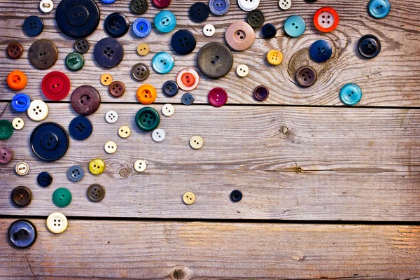 Botones vintage en mesa de madera vieja —  Fotos de Stock